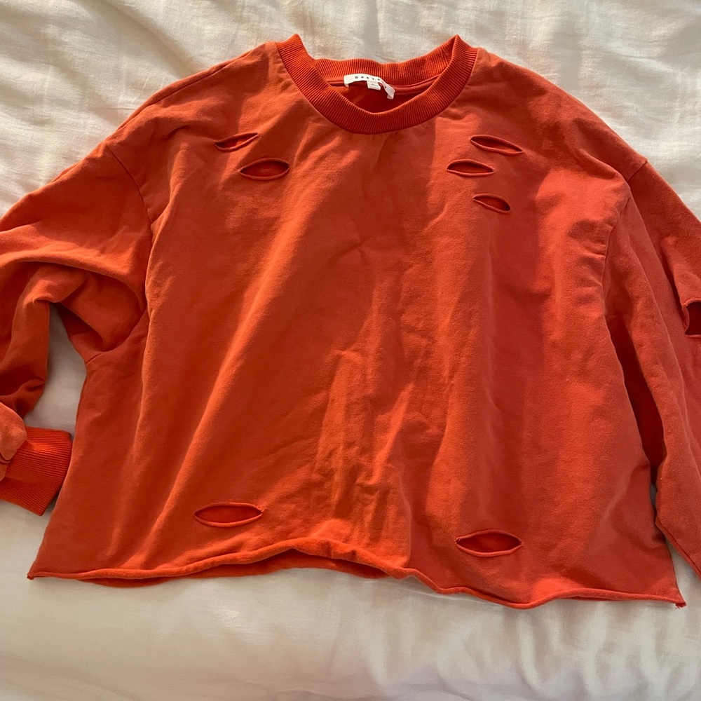 crew neck cropped red sweater with cut outs